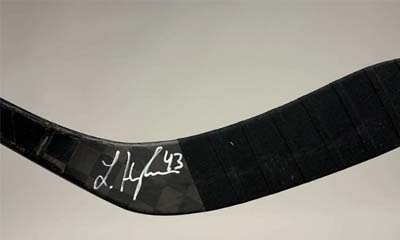 Win a Stick Hockey Signed by Luke Hughes